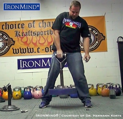 Carl-August Mertz on the Rolling Thunder portion of the Crushed-To-Dust! Challenge, a test of all-around grip -strength excellence that Carl-August Mertz passed with flying colors. IronMind® | Image courtesy of Dr. Hermann Korte/Choice of Champions gym