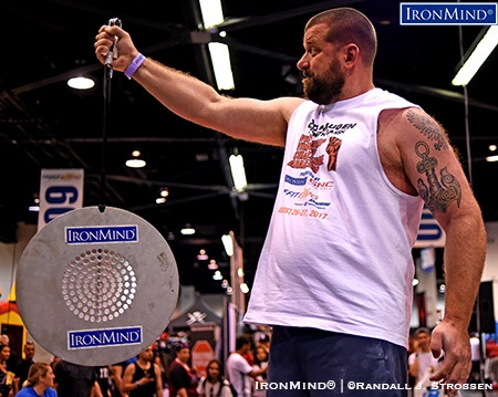 John Machnik clamped down on the CoC Silver Bullet with a Captains of Crush No. 3 gripper and hung on for a 33.28 to win the event, along with the overall title at Odd Haugen’s grip contest at the Anaheim FitExpo. IronMind® | ©Randall J. Strossen photo