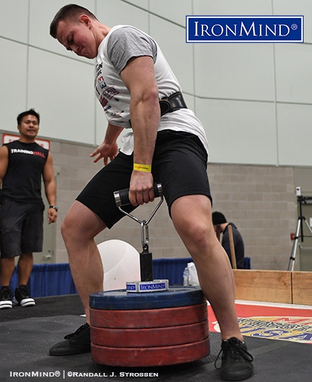 Aleksandr Filiminov (Russia) takes a crack at 100 kg on the Rolling Thunder® at the 2018 Los Angeles FitExpo. Filiminov holds the Teenage world record for the Rolling Thunder at 98 kg. IronMind® | ©Randall J. Strossen photo