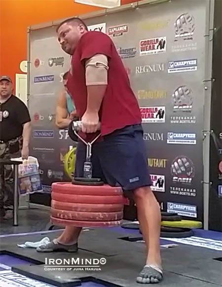 Alexey Tyukalov (Russia) pulling 131.75 kg on the Rolling Thunder, was the overall winner of the WAA grip contest in Moscow.  IronMind® | Courtesy of Gripmasters/Juha Harju