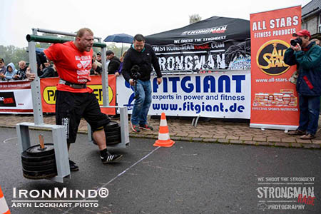 Michael Blumstein carries the 350-kg (770-lb.) yoke over the finish line to complete the final event in the Germany Pro League Finale to become the Strongest Man of Germany. IronMind® | Photo courtesy of Aryn Lockhart 