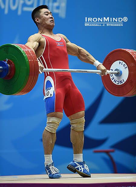 Kim Unguk cranks on this 154-kg world record snatch—the first of three he set tonight at the 2014 Asian Games. IronMind® | Randall J. Strossen photo