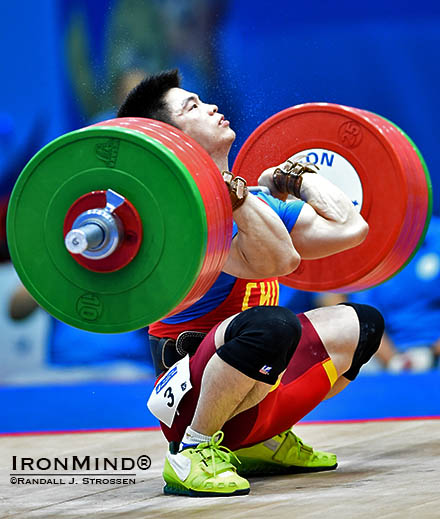 Lin Qingfeng hits rock bottom with 200 kg, attempting a world record in the clean and jerk at the Asian Games tonight. IronMind® | Randall J. Strossen photo