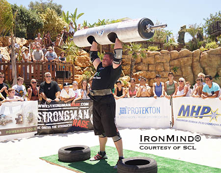 Martin Wildauer completes six reps in the overhead log event (140 kg).  IronMind® | Photo courtesy of SCL