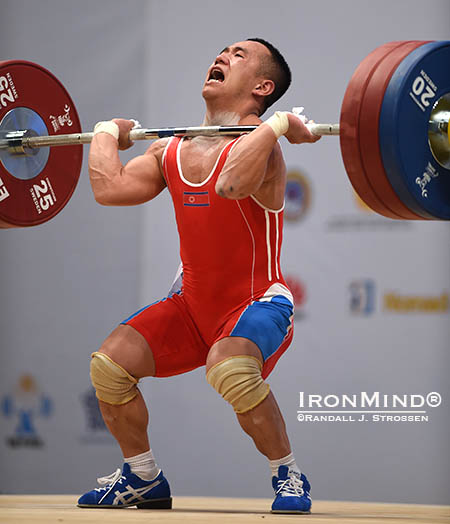 After missing the jerk on his opener (162 kg), Om Yun Chol (North Korea), came back to make it and then, on the last attempt in the class, hit this good lift with 168 kg for the gold medal in the jerk and in the total. IronMind® | Randall J. Strossen photo 