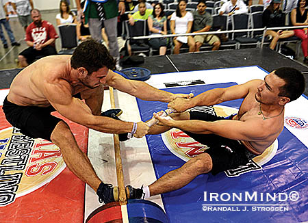 Sean Couch (left) mixes it up with mas wrestling world champion Alexandr Arinkin (right). IronMind® | Randall J. Strossen photo   