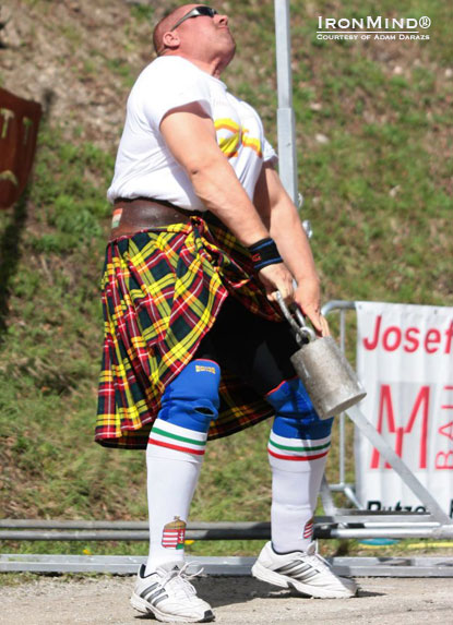 Overall winner of the 2012 Hungarian Highland Games Strength Challenge, Adam Darazs on the  56-lb. for height.  IronMind® | Photo courtesy of Adam Darazs.