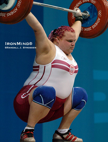 Agata Wrobel hits this 130-kg snatch at the Athens Olympics, where she was a bronze medalist in the women’s +75-kg category.  IronMind® | Randall J. Strossen photo.