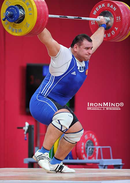 The go-ahead lift: turned out that this 209-kg snatch gave Ruslan Albegov the margin he needed for victory over a hard charging Bahador Moulaei.  Albegov got the weight overhead strongly, but then had to take two quick steps forward to save the lift as he stood up.  IronMind® | Randall J. Strossen photo