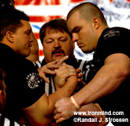 Leonard Harkless (center) makes Marcio Barboza (left) and Travis Bagent (left) street legal in the 2005 Arnold Armwrestling men's superheavyweight final. IronMind® | Randall J. Strossen, Ph.D. photo.