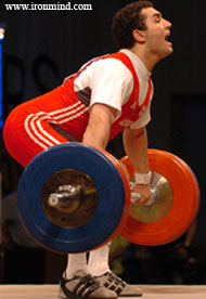 Arsen Kasabiev (Georgia) starts 165 kg on it journey to arms' length overhead - this was his second snatch. IronMind® | Randall J. Strossen, Ph.D. photo.