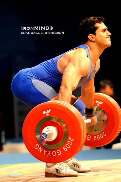 Ashgar Ebrahimi (Iran) launches 181 kg in the snatch while competing as a 94-kg lifter at the 2009 World Weightlifting Championships (Goyang, Korea).  Even if you’re not involved at the competitive level, the sport of weightlifting offers tremendous tools to other athletes as well as to people primarily interested in fitness.  IronMind® | Randall J. Strossen photo.