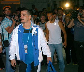 Pyrros Dimas (Greece) wades through a sea of admirers Saturday night, following the weightlifting competition. IronMind® | Randall J. Strossen, Ph.D. photo.