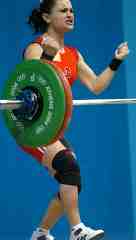 Nurcan Taylan celebrates her second world record of the night in the snatch, 97.5 kg. IronMind® | Randall J. Strossen, Ph.D. photo.