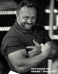 Ten years after Huntly Castle, Bill Kazmaier, maybe looking mightier than ever, flexes his arm at the 1997 World's Strongest Man contest. IronMind® | Randall J. Strossen, Ph.D. photo.