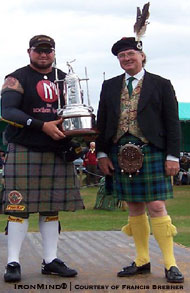 "Larry Brock is presented with the overall trophy by the Chieftain of the Games." IronMind® | Photo courtesy of Francis Brebner.
