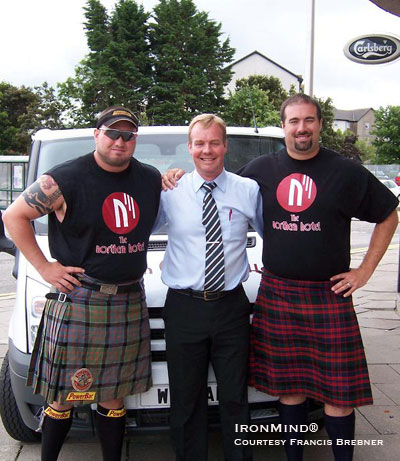 Larry Brock (left) and Sean Betz (right) relax in front of Aberdeen's Northern Hotel, with its owner, Gary Cox, who is sponsoring the two top Highland Games heavies. IronMind® | Photo courtesy of Francis Brebner.