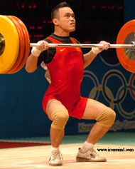 Cen Biao goes under 156-kg, on his way to winning the 56-kg category at the Junior World Weightlifting Championships today. IronMind® | Randall J. Strossen, Ph.D. photo.