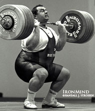 Andrei Chemerkin (Russia) cranks on 262.5 kg, on his way to a commanding clean and jerk at the 1997 World Weightlifting Championships (Chiang Mai, Thailand). IronMind® | Randall J. Strossen, Ph.D. photo.