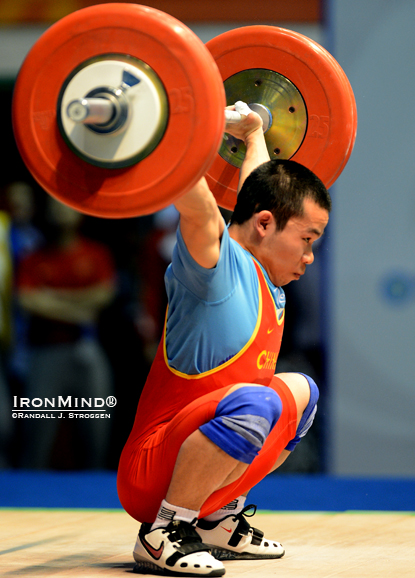 Chen Hongquing sank the putt on this 135-kg snatch, on his way to winning all three gold medals in the men’s 62-kg class at the 2012 Asian Weightlifting Championships.  IronMind® | Randall J. Strossen photo.