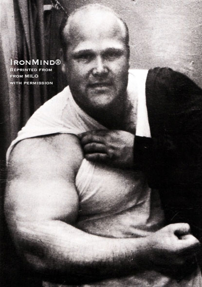 Chuck Ahrens flexing his massive arm in a rare photo.  Reprinted from MILO: A Journal For Serious Strength Athletes (Volume 2 - Number 1) with permission.  Copyright IronMind® Enterprises, Inc.