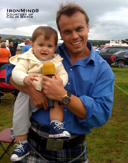 Nearly 10-month-old Wee Laurence Bryce looks perfectly comfortable being at the hot end of a microphone as his dad, Colin, takes a break from calling the action at the Callander Highland Games.  IronMind® | Photo courtesy of Colin Bryce.