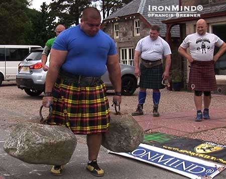 Peter Puzser takes a walk on the wild side, carrying the Dinnie Stones 18’ 4”.  IronMind® | Francis Brebner photo