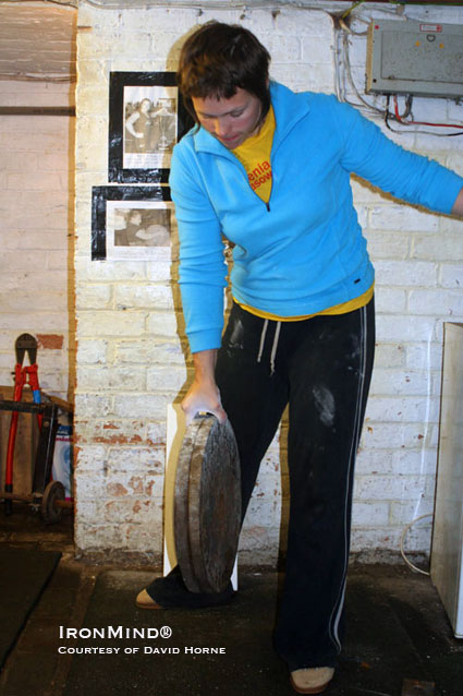 Elizabeth Horne pinch grips a pair of 20-kg plates.  IronMind® | Photo courtesy of David Horne.