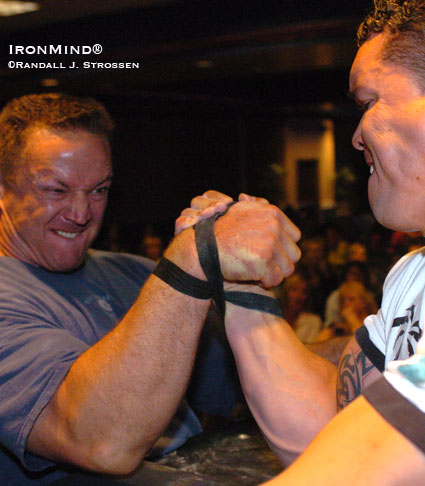 Californian Eric Woelfel (left) locks up with Brazil’s Marcio Barboza (Boomtown, NV 2004).  IronMind® | Randall J. Strossen photo.