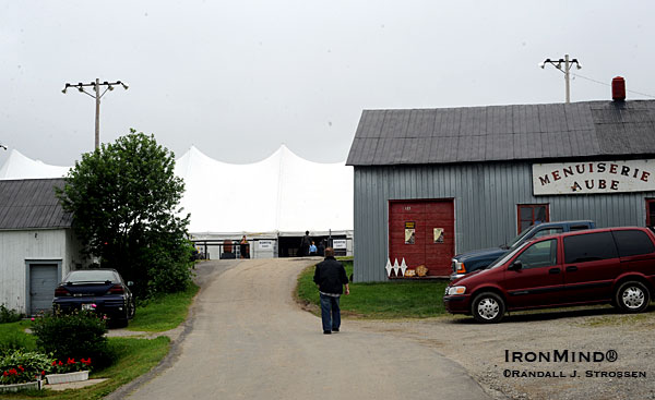 A billowing white tent - the perfect setting for what Mayor Carl Dubé was the first to envision . . . a strongman contest honoring Louis Cyr that came to be called Fortissimus and that took root in his village, Notre-Dame-du-Rosaire.  IronMind® | Randall J. Strossen photo.