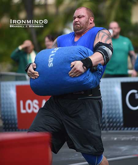hafthor-wsm14_The Icelandic giant Hafthor Julius Bjornsson races with a 275-lb. IronMind sandbag in the loading event at the World’s Strongest Man contest today at the Commerce Casino.  Will this be his year?  IronMind® | Randall J. Strossen photo