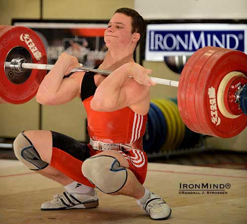 Look at Ian Wilson’s left foot as he hits the bottom with this 194-kg clean.  With a little work, Wilson stood up and then punched the bar overhead for a good lift and a new American junior national record in the clean and jerk.  IronMind® | Randall J. Strossen photo.