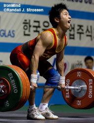 56-kg Ji Guohua (China) starts 150 kg on its way to becoming the new Asian Youth Record in the clean and jerk. IronMind® | Randall J. Strossen, Ph.D. photo.