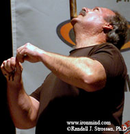 Snapping keys in half while balancing a sledgehammer, John Brookfield entertains the crowd at the 2005 IRONMAN Pro (Pasadena, California). IronMind® | Randall J. Strossen, Ph.D. photo.