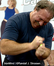 John Brookfield blows through a tennis ball at the 2004 Arnold. IronMind® | Randall J. Strossen, Ph.D. photo.