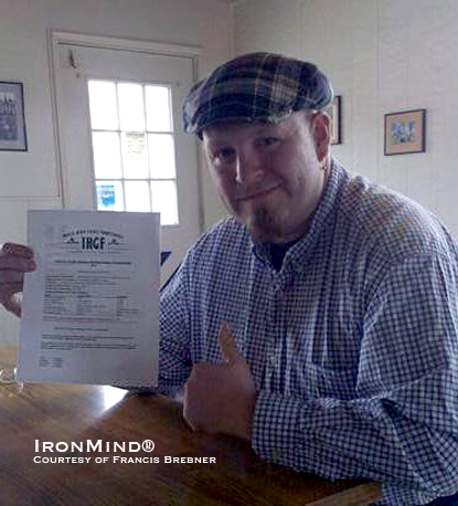 Jon McKenzie shows the IHGF contract that makes it official: the Spokane Highland Games will host the 2011 IHGF Amateur Highland Games World Championships.  IronMind® | Courtesy of Francis Brebner.