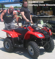 Jon Andersen, who finished third this weekend, and Magnus Ver Magnusson, who refereed, check out the ATVs. IronMind® | Photo courtesy of Dione Wessels.