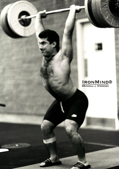 Khaki Khakiashvili forgot his lifting shoes one day—no problem for the 90-ish kg Olympic gold medalist to still snatch 160 kg and clean and jerk 200 kg in a pair of Adidas flip flops, but maybe don’t count on being able to do likewise yourself.  IronMind® | Randall J. Strossen photo.
