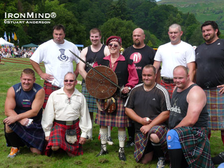 Chieftain of the Games David Webster O.B.E. is surrounded by heavies at the 2011 Killian Highland Games.  IronMind® | Stuart Anderson photo.