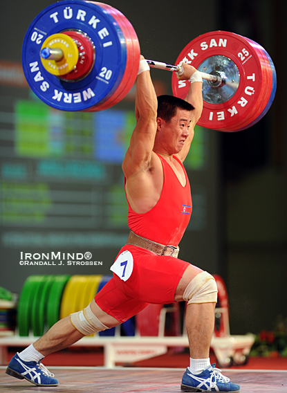 Kim Un Guk (North Korea) stuck this 173-kg jerk to win two gold medals and one silver medal in the 62-kg category at the 2010 World Weightlifting Championships tonight.  IronMind® | Randall J. Strossen photo.