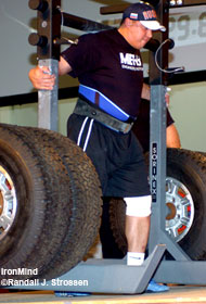 Mikhail Koklyaev (Russia) bears the burden of the MET-Rx Heavy Yoke at the 2006 Arnold Strongman contest. IronMind® | Randall J. Strossen, Ph.D. photo.