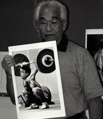 Tommy Kono shares his enormous lifting knowledge with the help of carefully-selected photos. This was at a seminar hosted by Bill Kutzer, at California State University - Sacramento, the center of the universe for Northern California weightlifting in recent years thanks to Bill's leadership. IronMind® | Randall J. Strossen, Ph.D. photo.