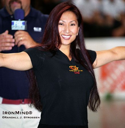 Lene Karlsen gives the Hercules Hold a lift at Jim Davis’s 2003 American Strongman Championships.  IronMind® | Randall J. Strossen photo.