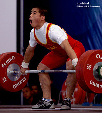 Li Zheng won the snatch by four kilos with this 128-kg lift, and he needed every one of them as he also took the gold in the total, but only by one kilo. IronMind® | Randall J. Strossen, Ph.D. photo.