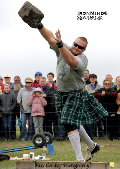 Luke Reynolds on the two-handed 70-lb. stone putt.  IronMind® | Photo courtesy of Kree Combey Photography.