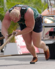 With some of the world's very strongest hands and arms, Magnus Samuelsson grabs a winning time in the truck pull at the 2004 WSM contest - when you have arms with this kind of size and strength, it's almost like having an extra pair of legs (Paradise Island, Bahamas). IronMind® | Randall J. Strossen, Ph.D. photo.