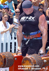 Fuse lit, Mariusz Pudzianowski motors through the Farmer's Walk at the MET-Rx WSM Super Series Grand Prix at Muscle Beach. Mariusz won the contest and went on to win the 2005 MET-Rx World's Strongest Man contest as well. IronMind® | Randall J. Strossen, Ph.D. photo.