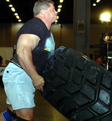 Mark Philippi on the tire flip at the 2004 US Strongman Nationals (MHP Pro Strongman Invitational) in Atlanta, Georgia. IronMind® | Randall J. Strossen, Ph.D. photo.