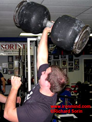 Arron "Meatball" Provence hoists the massive dumbbell that you might see in action at the Arnold strongman competition. IronMind® | Richard Sorin photo.