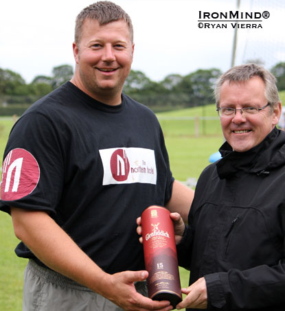 Overall winner at the Stonehaven Highland Games Mike Pockoski receives a fitting award from Glenfiddich representative David Massy.  IronMind® | Ryan Vierra photo.